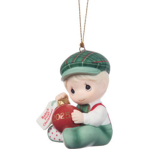 Christmas ornament of a child holding a '2025' ornament on a white background
