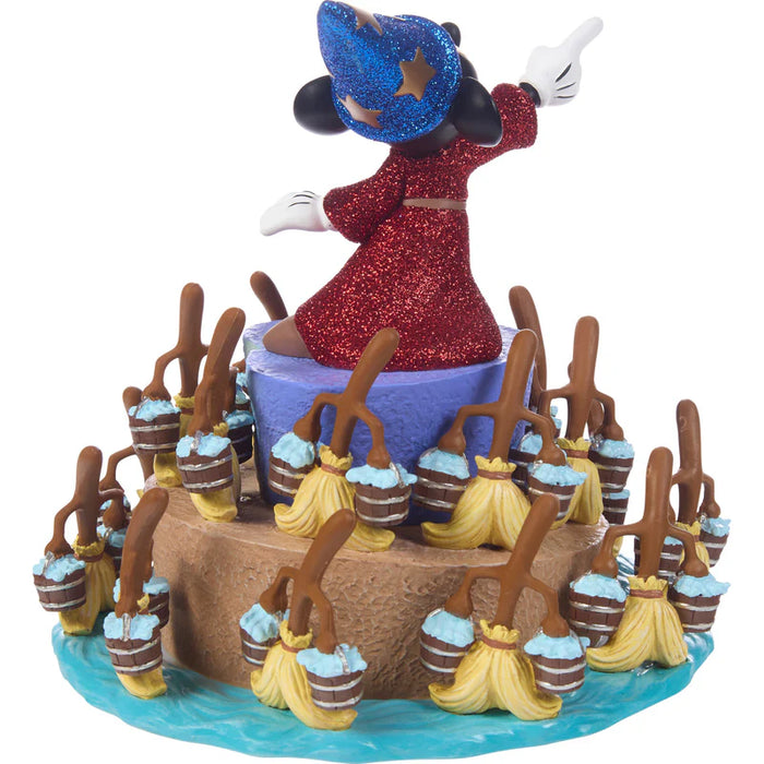 Figurine of a character in a red dress and blue hat with brooms and baskets on a white background