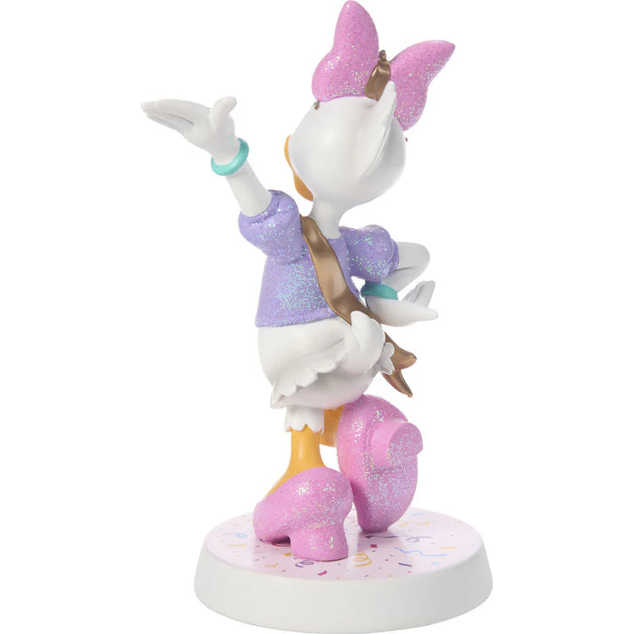 Animated character figurine with a pink bow and purple outfit on a white background