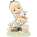 Figurine of a girl holding a dog with a clock, surrounded by small animals and a basket on a white background.