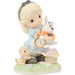 Figurine of a girl holding a clock with two dogs and a basket on a white background