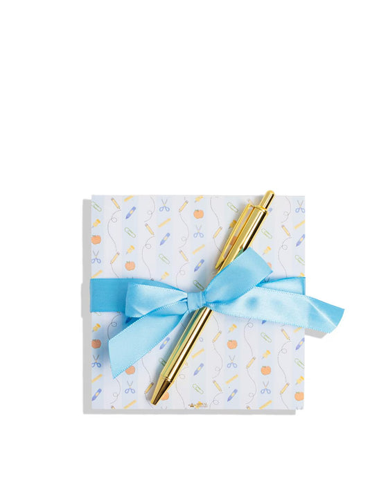 Notebook with a gold pen and blue ribbon on a white background