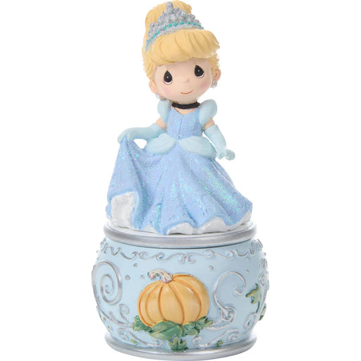 Cinderella figurine in a blue dress with a pumpkin on a white background