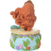 Decorative figurine of a mermaid with flowing hair on a blue base with floral and seaweed design.