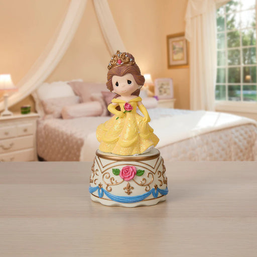 Princess figurine on a decorative base in a bedroom setting
