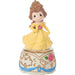 Figurine of a princess in a yellow dress with a tiara on a white background