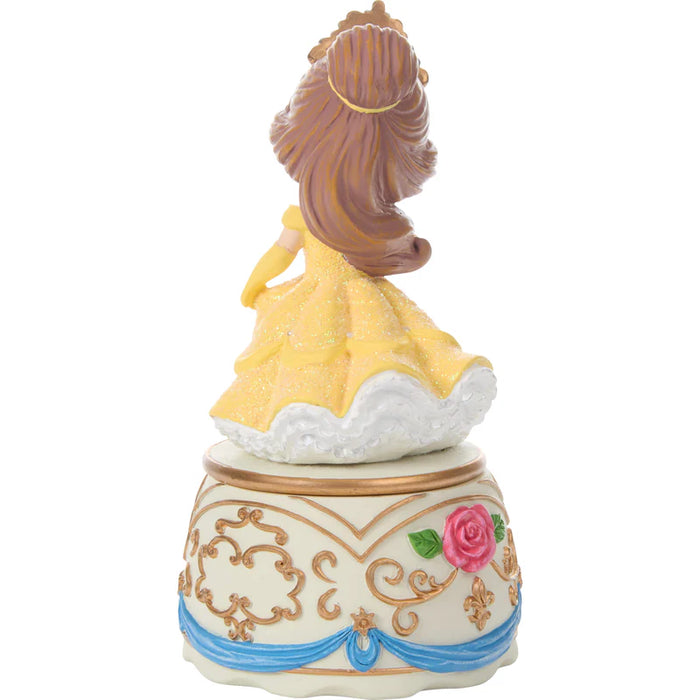 Decorative figurine of a princess in a yellow dress on a white background