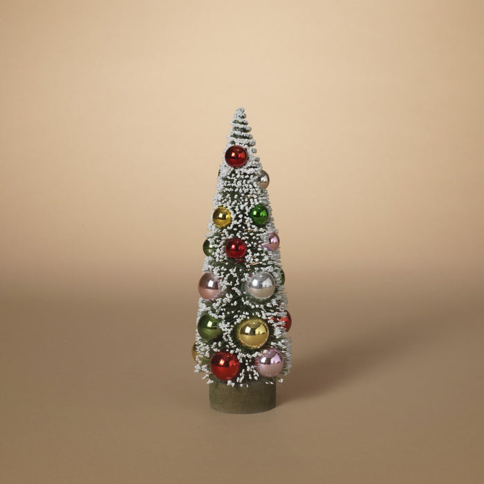 Decorative Christmas tree with colorful ornaments on a beige background