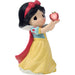 Snow White figurine holding an apple on a white background