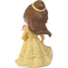 Figurine of a character in a yellow dress with a pink flower on a white background