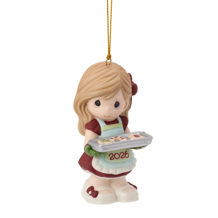 Ornament of a girl holding a tray with '2026' on a white background