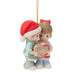 Christmas ornament of two children holding a heart with '2026' on a white background