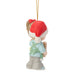 Christmas ornament of a child wearing a red Santa hat on a white background