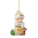 Christmas ornament of a child in a stocking with '2026 Baby's 1st Christmas' text, holding a teddy bear.