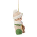 Decorative Christmas ornament of a child in winter clothing with a teddy bear, hanging on a white background.