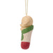 Decorative ornament of a dog in a knitted sweater on a white background