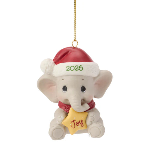 Christmas ornament of an elephant wearing a Santa hat with '2026' and holding a 'Joy' sign on a white background.