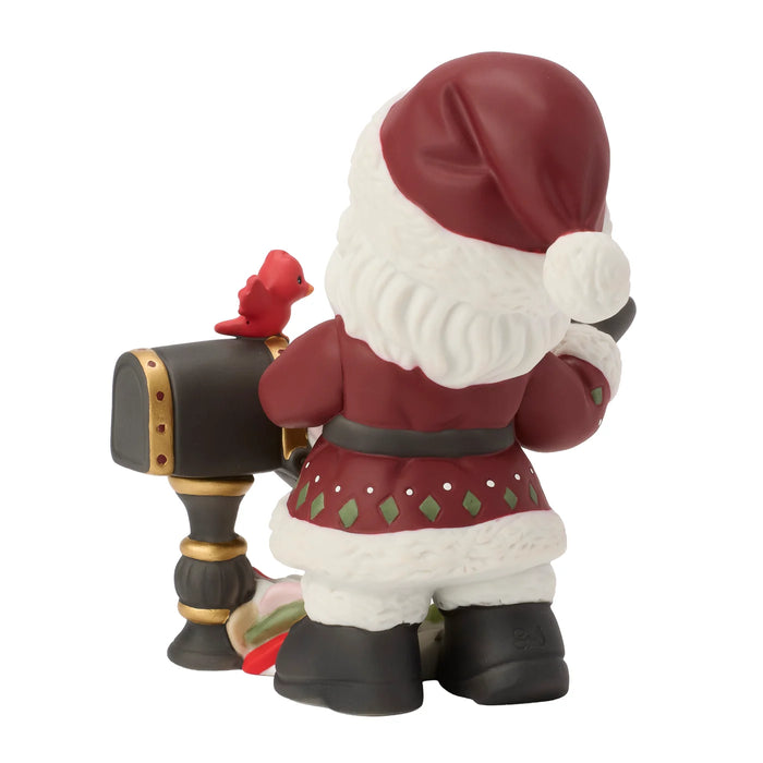 Santa Claus figurine with a mailbox on a white background
