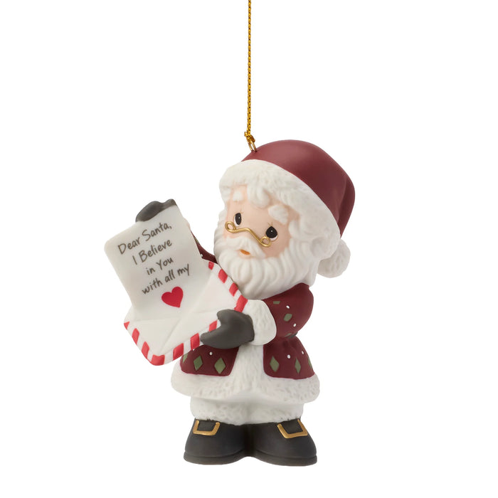 Santa Claus ornament holding a letter with a heart on a white background