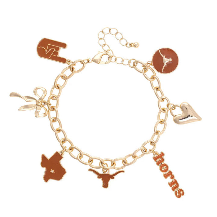 Gold bracelet with various charms on a white background