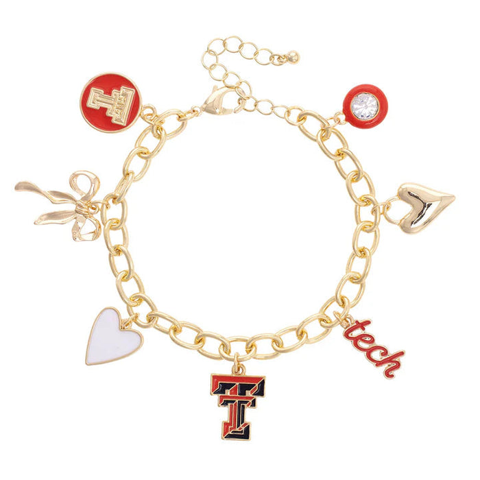 Gold charm bracelet with various charms on a white background