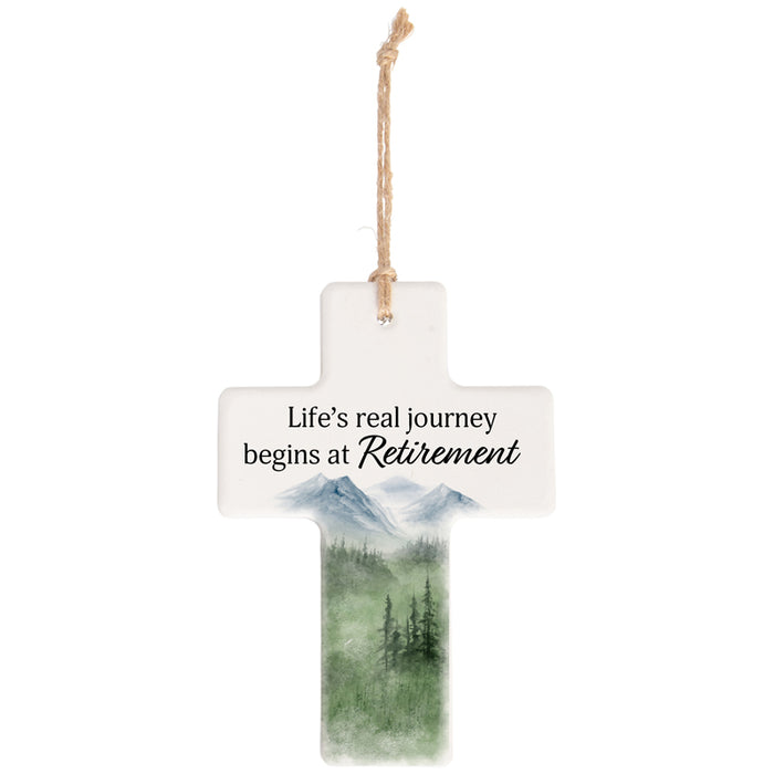 Decorative hanging sign with mountain scene and retirement quote on a white background