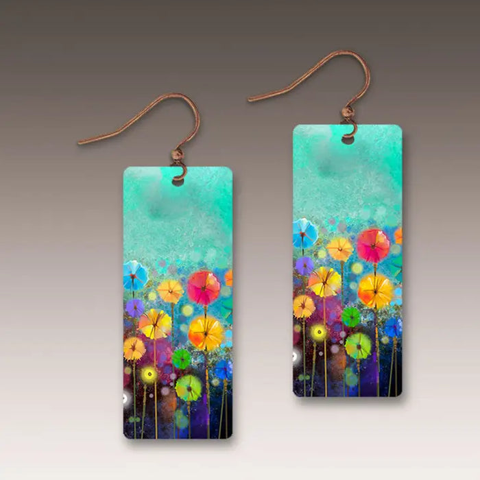 Colorful floral earrings on a gradient background