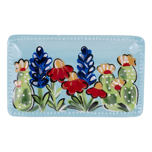 Decorative tray with colorful floral and cactus design on a light blue background