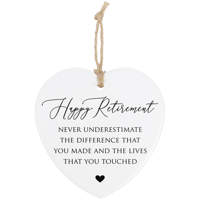 Heart-shaped hanging plaque with retirement message on a white background