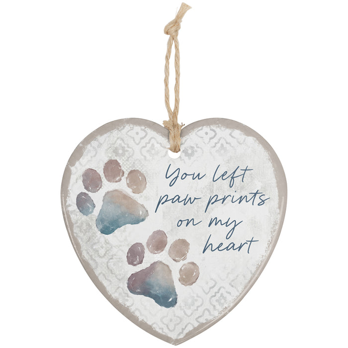 Heart-shaped hanging ornament with paw prints and text on a white background