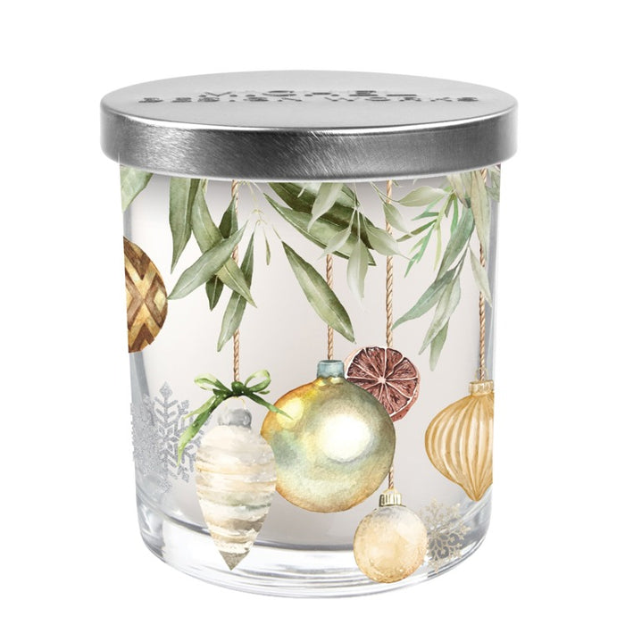 Glass jar with decorative Christmas ornaments and a silver lid on a white background