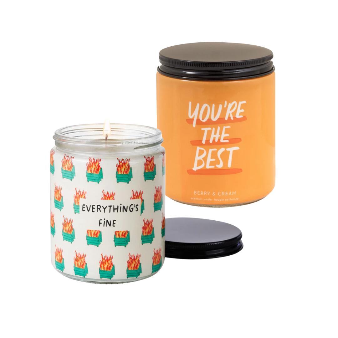 Two candles with humorous text designs on a white background