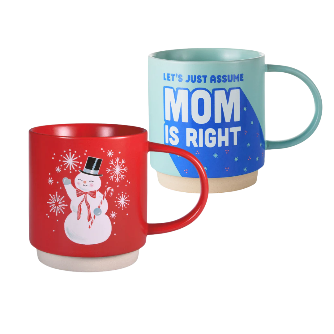 Two mugs, one red with a snowman design and the other blue with text, on a white background.