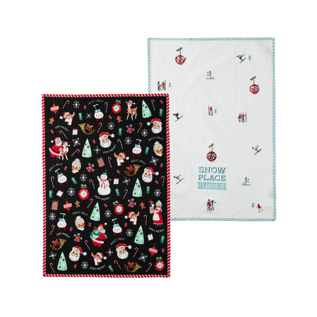 Two Christmas-themed towels, one black with festive patterns and the other white with a 'Snow Place' design.