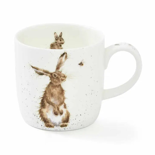 White mug with rabbit illustration on a white background