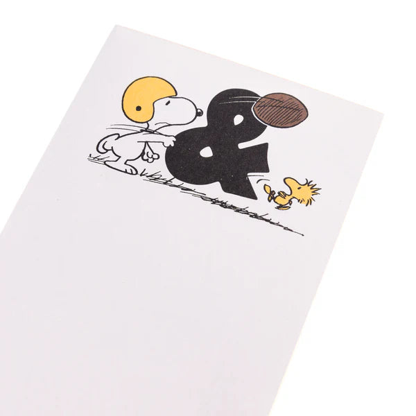 Notebook with cartoon characters and an ampersand design on a white background