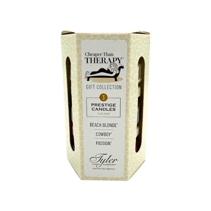 Box of Tyler Prestige Candles with labels for 'Beach Blonde', 'Cowboy', and 'Passion' scents on a white background.