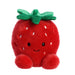 Plush strawberry toy with a smiling face on a white background