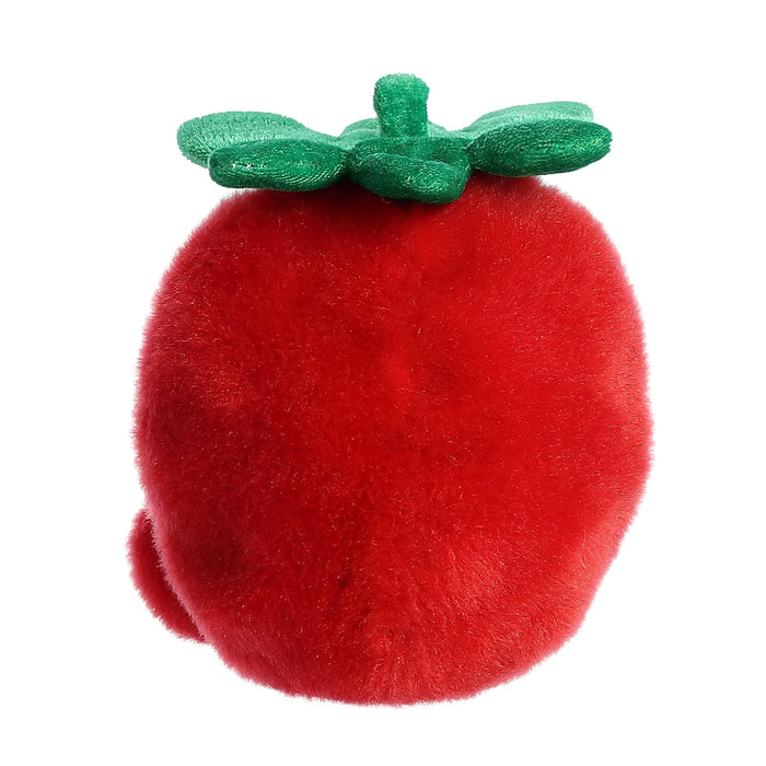 Red plush apple with green leaves on a white background