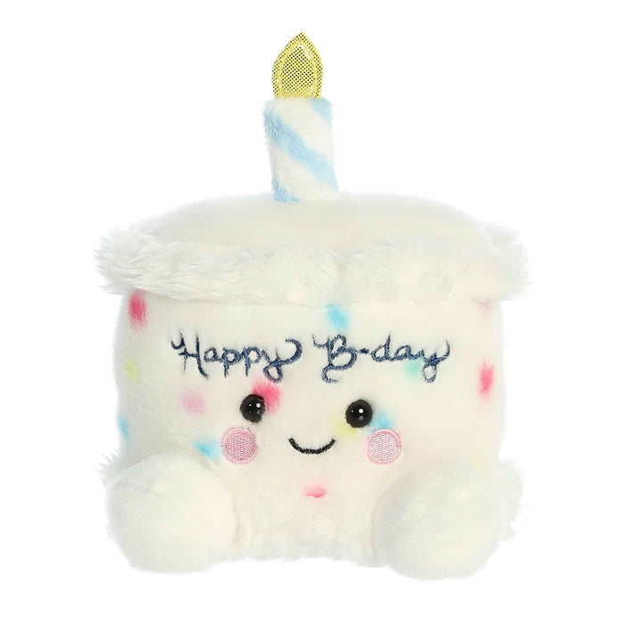 Plush toy shaped like a birthday cake with a candle and 'Happy B-day' text on a white background