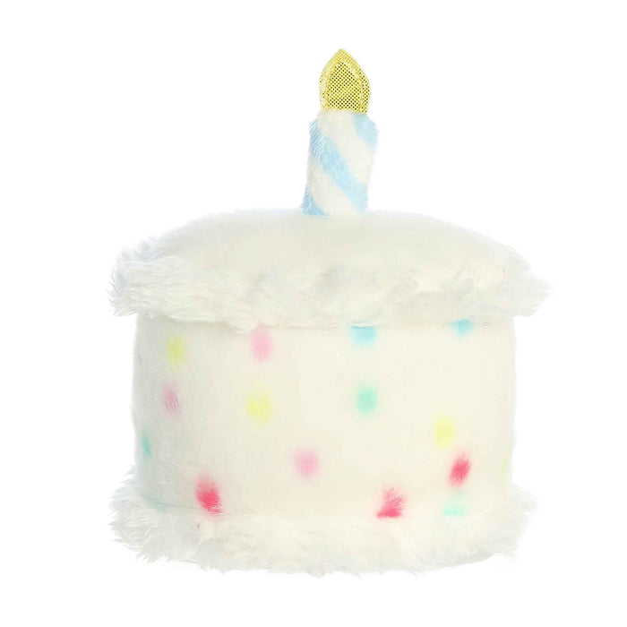 Plush toy shaped like a birthday cake with colorful candles on a white background