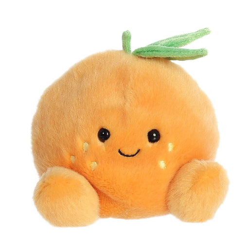 Plush toy resembling a carrot with a smiling face on a white background