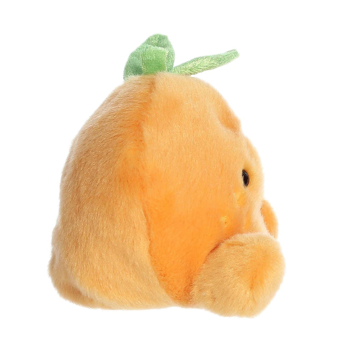 Plush toy shaped like a peach with a green stem on a white background