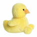 Yellow plush duck toy on a white background