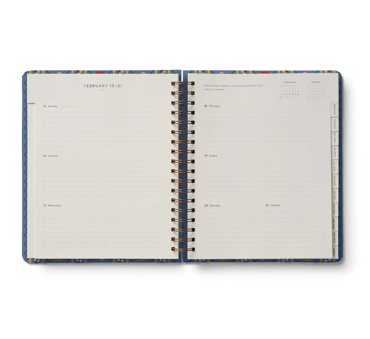 Open planner with blue and white design on a white background