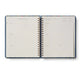 Open planner with blue and white design on a white background