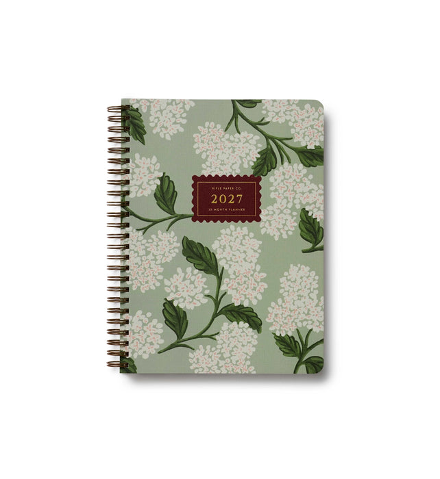 Floral patterned notebook with '2027' on a white background