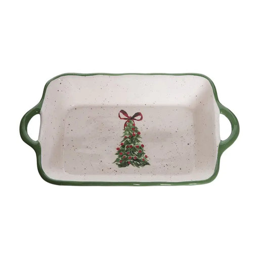 Rectangular ceramic dish with Christmas tree design and green handles on a white background