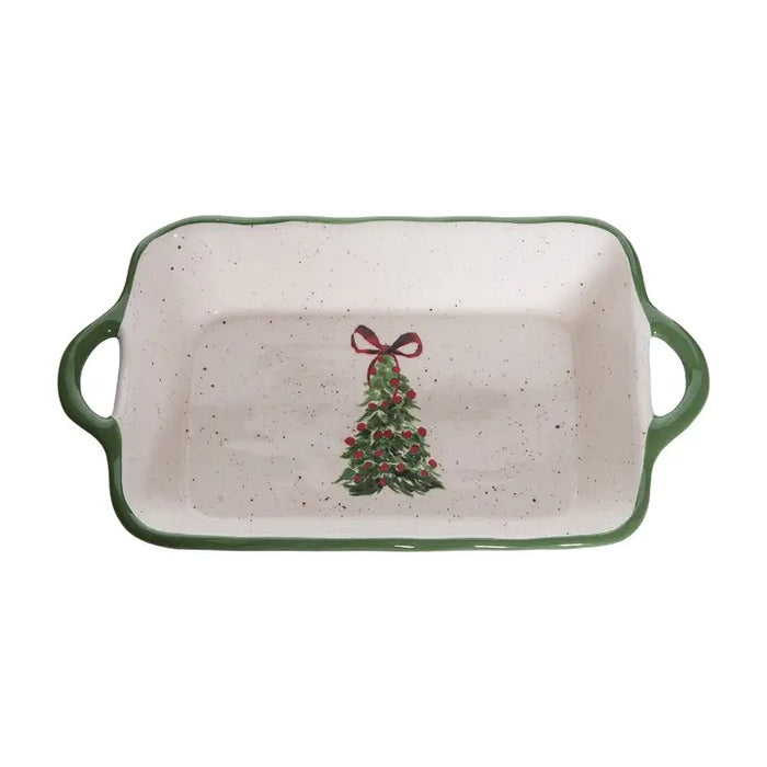 Rectangular ceramic dish with Christmas tree design and green handles on a white background