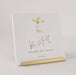 Notebook with 'Be Still and Know That I Am God' text and floral design on a light background